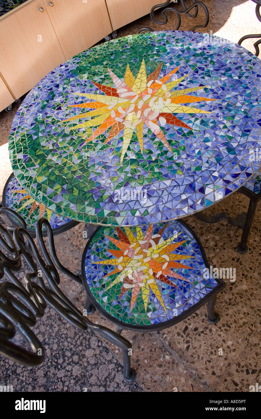 modern ceramic covered table Spain multi coloured tiles Stock Photo