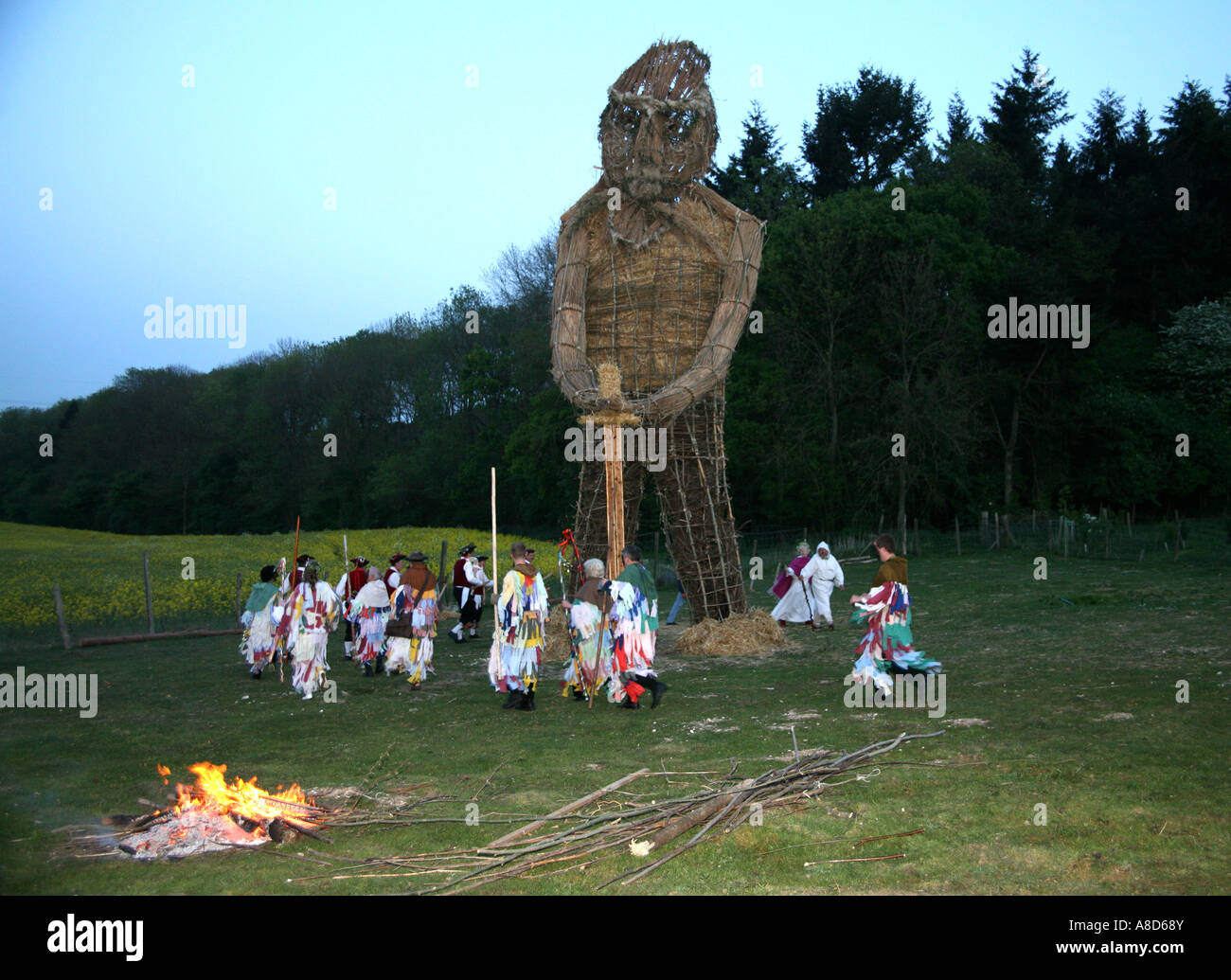 Pagans dance round the Wicker Man Stock Photo