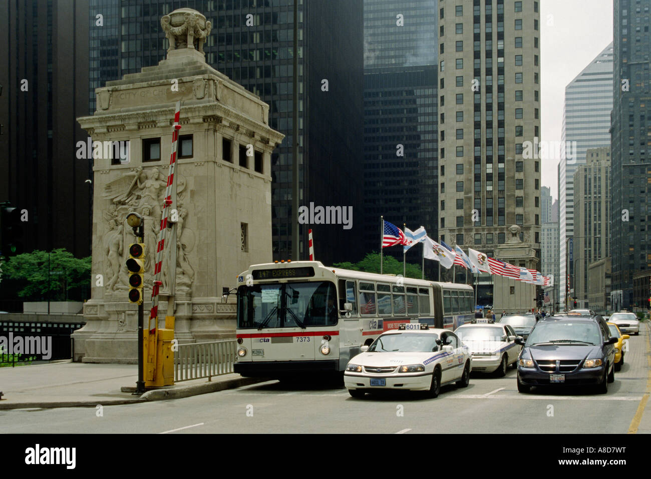 A CITY BUS TAXIS and other vehicles cross the MICHIGAN STREET BRIDGE CHICAGO ILLINOIS Stock Photo