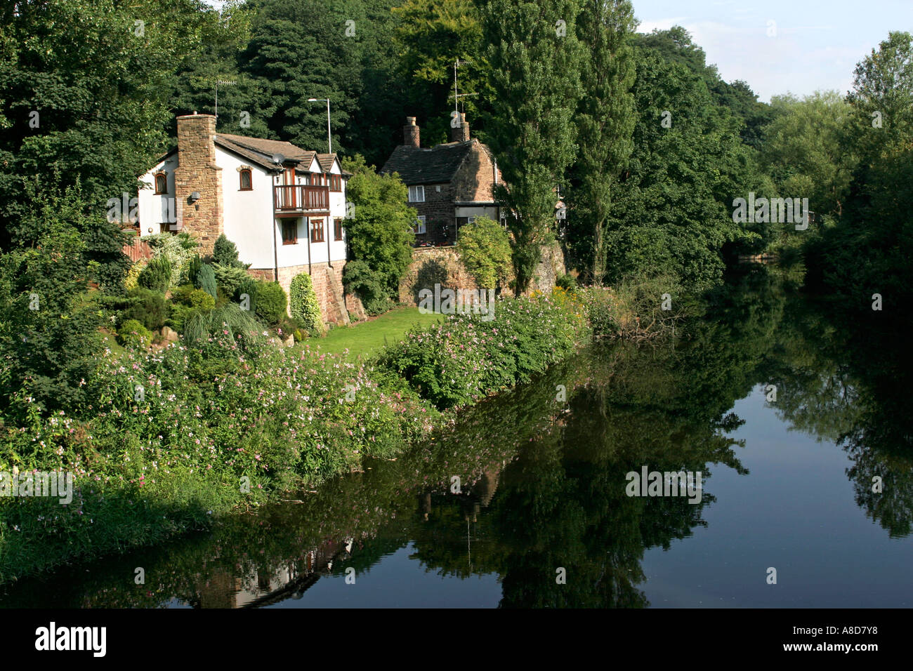Cheshire Stockport Chadkirk Otterspool cottages on banks of River Goyt Stock Photo