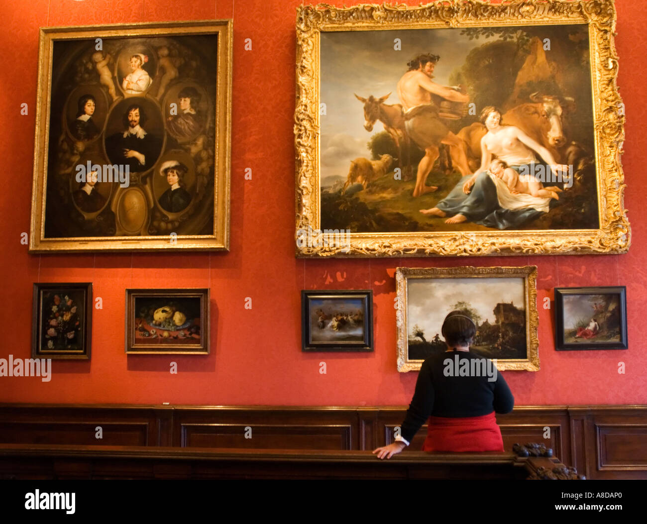 Visitors looking at paintings inside famous Mauritshuis art gallery in The Hague Netherlands Stock Photo
