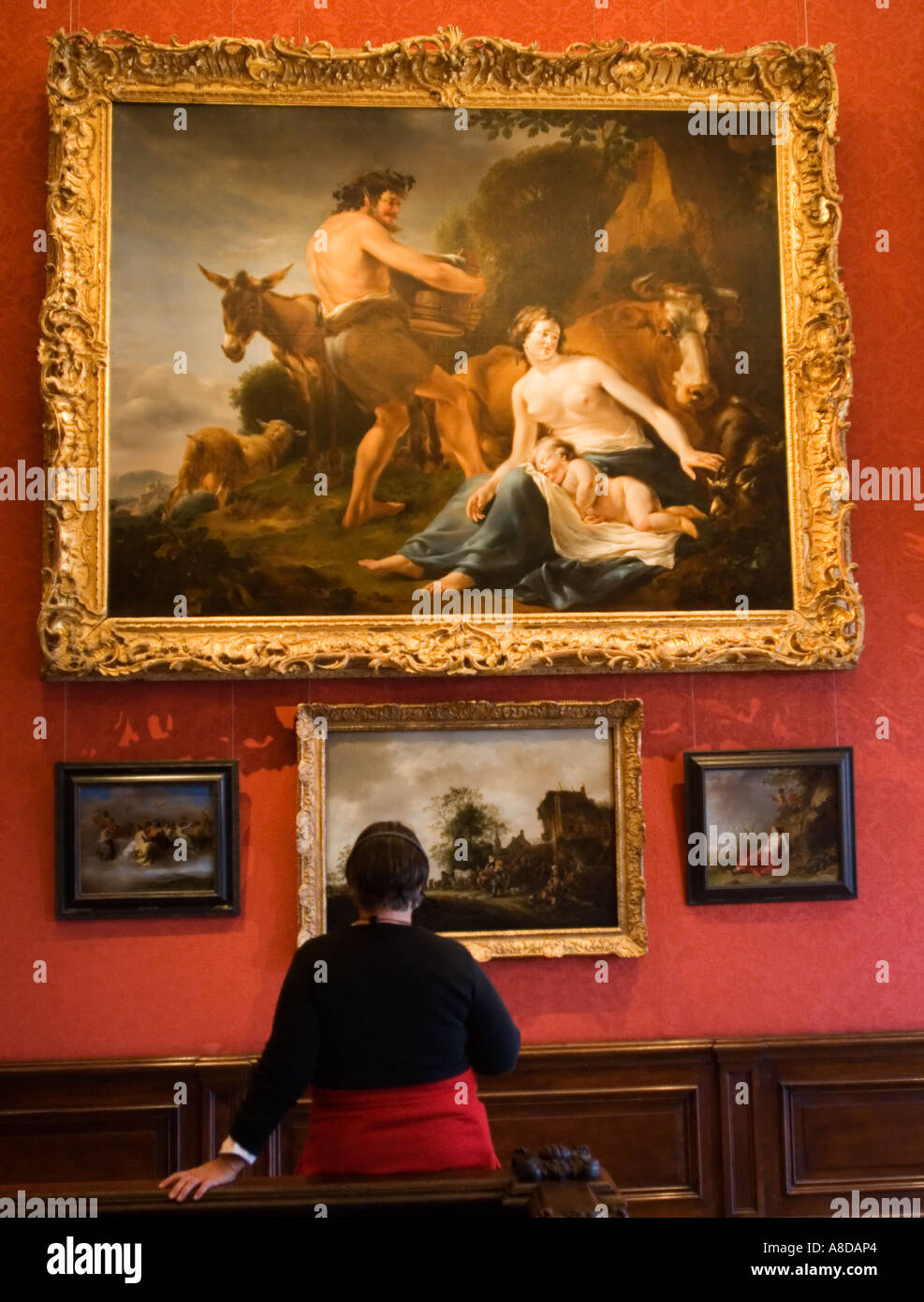 Visitors looking at paintings inside famous Mauritshuis art gallery in The Hague Holland Stock Photo