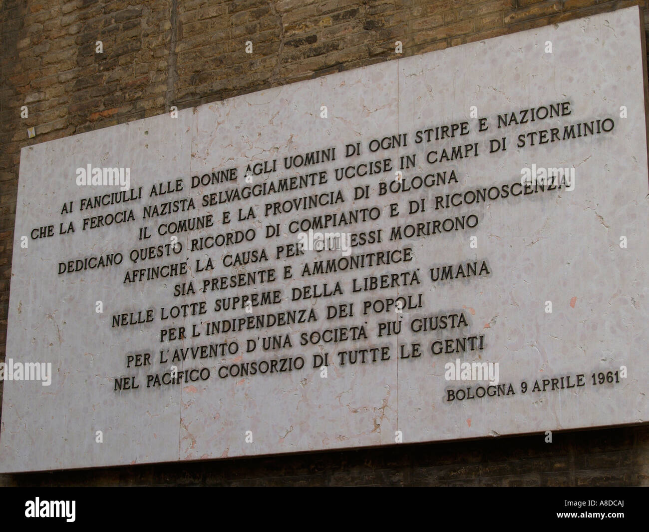 On the wall outside Sala Borsa in piazza del Nettuno is the memorial to Bolognese partisans killed by fascists during WWII. Stock Photo
