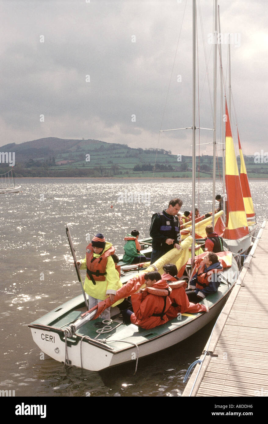 Primary school children on an adventure outing learning to sail a small