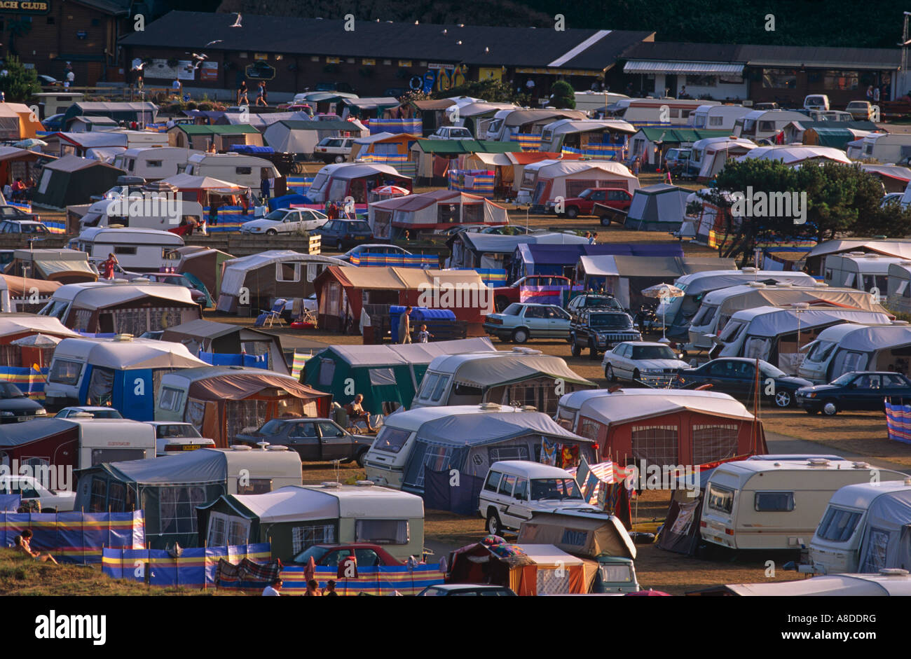 Dozens of caravans cramped together in the soft sunshine in St Austell on the south Cornish coast England Stock Photo