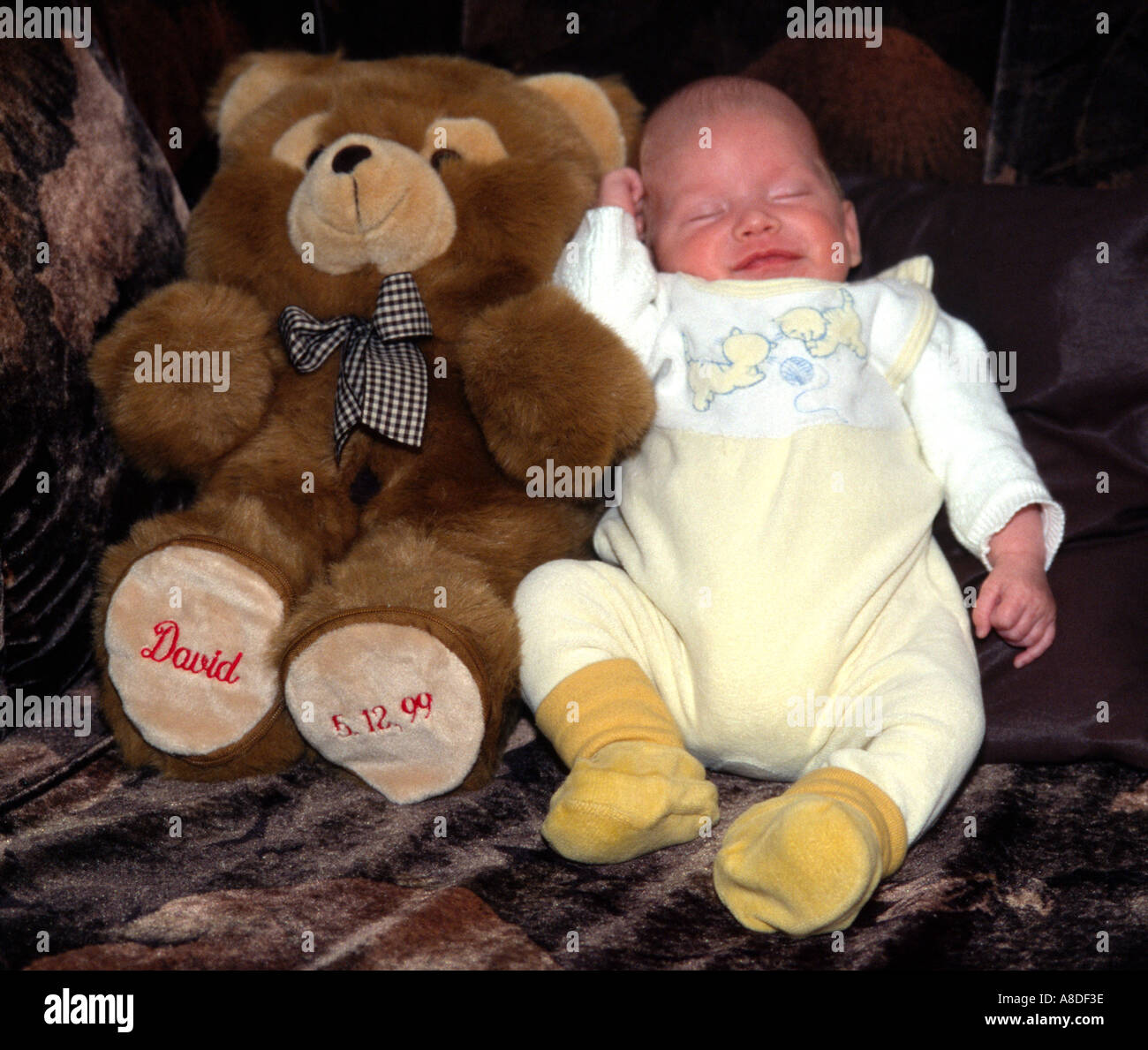 Baby and teddy bear Stock Photo - Alamy