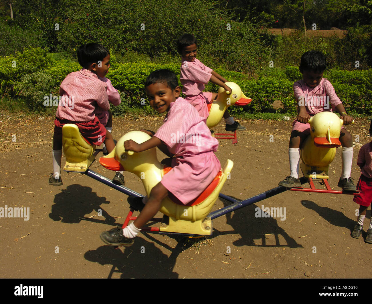Children playing round hi-res stock photography and images - Alamy