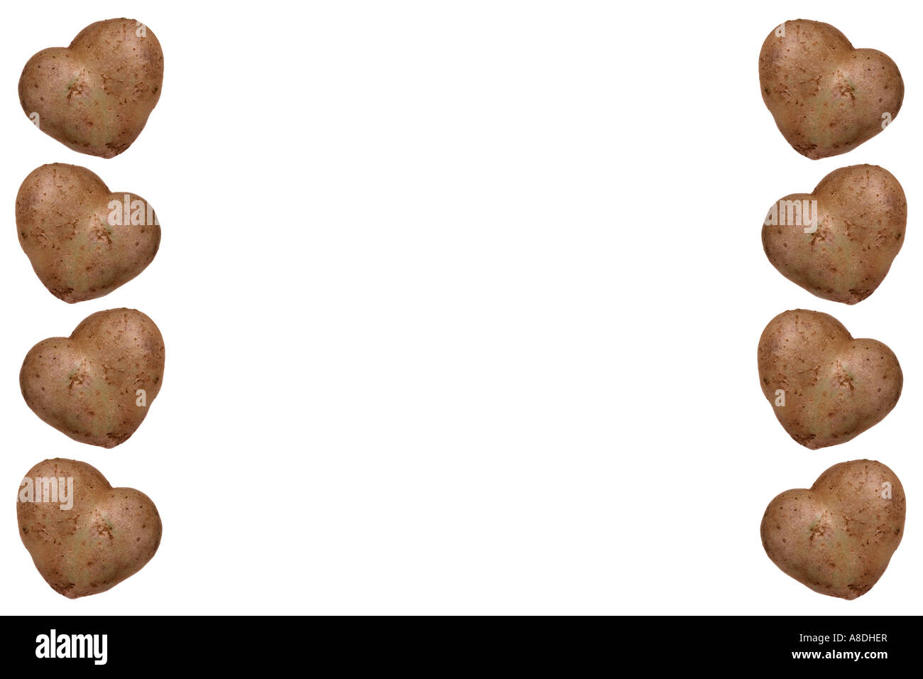 Heart shaped potato border against a white background Stock Photo - Alamy