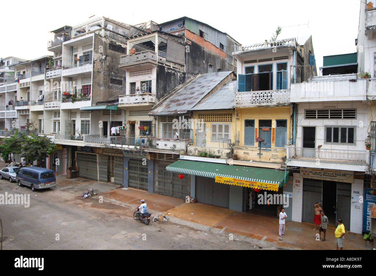 Street of houses shops and guest houses in central Phnom Penh in Cambodia in South East Asia Stock Photo