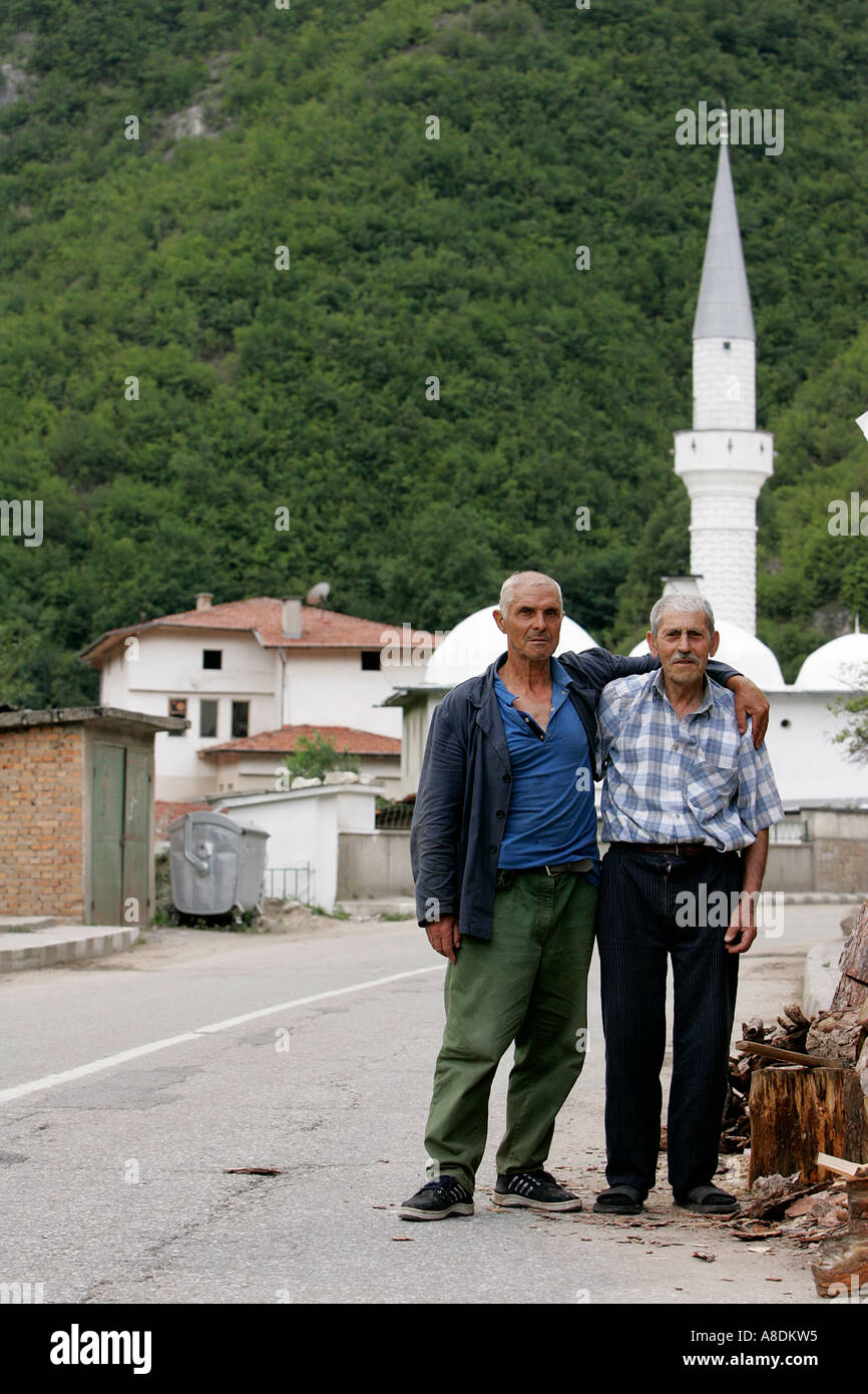 Dospat old city Rodopy mountain house elderly man male gentlemen shop Bulgaria people Republic Balkan Peninsula Europe cow Stock Photo