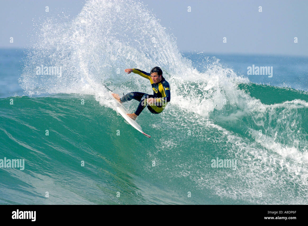Surfing Rider Surfer riding a Wave Stock Photo - Alamy