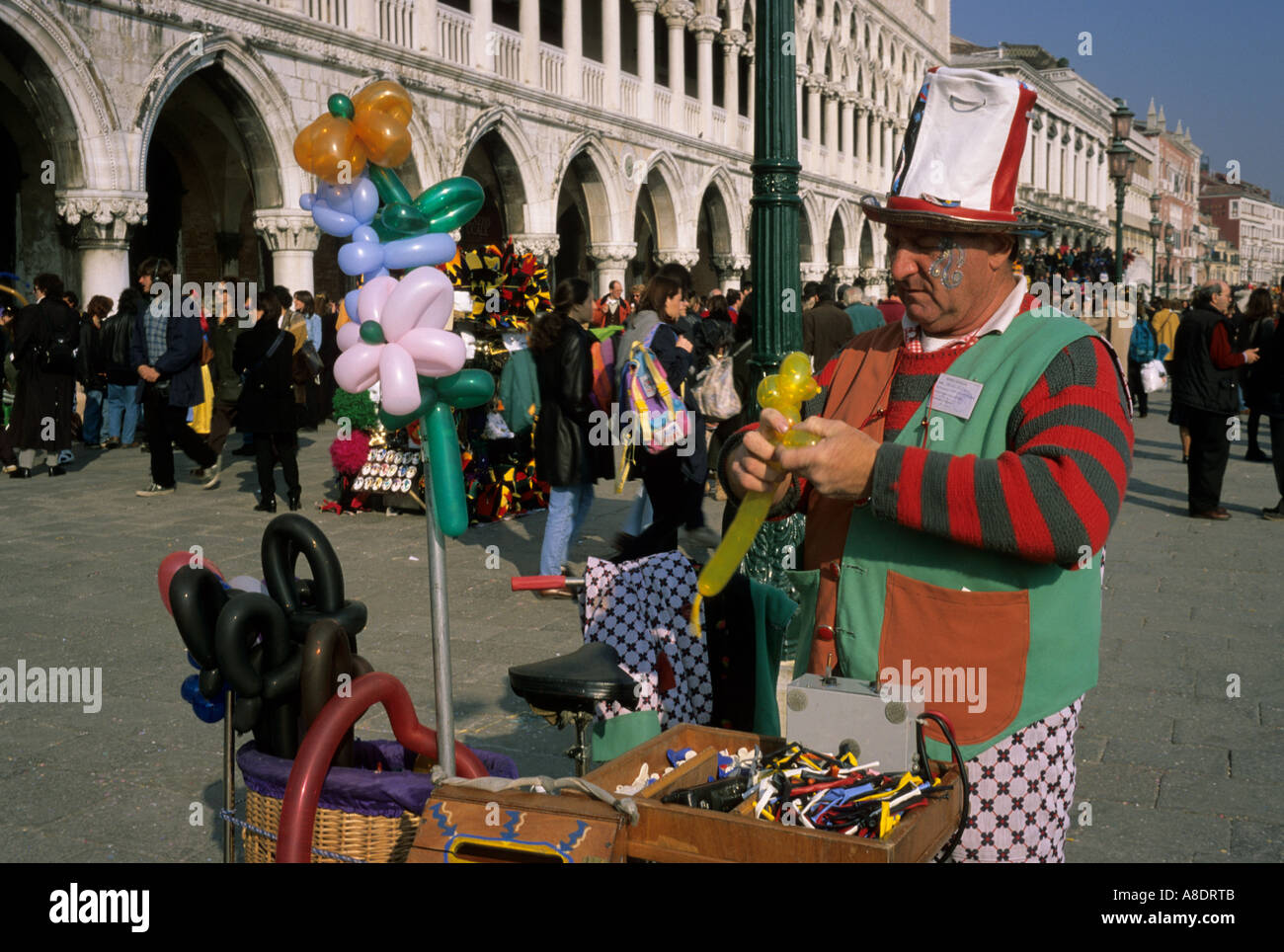 man selling child s balloons during the carnival in Venice Italy Stock Photo