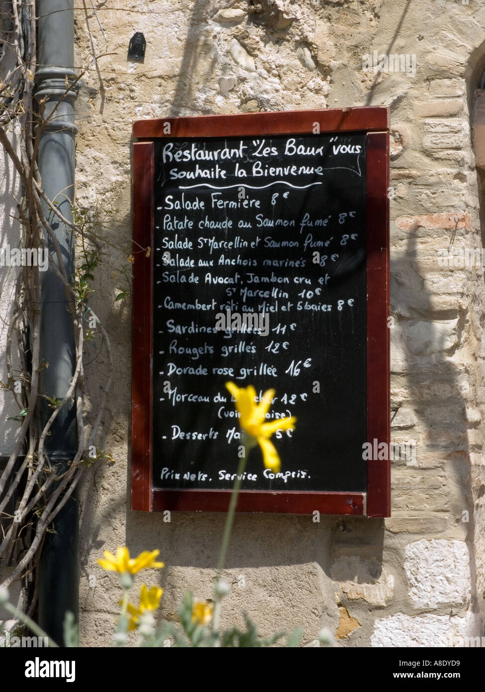 The lunch menu on a blackboard of a restaurant in the medieval walled town of Carcassonne in the south west of France Stock Photo