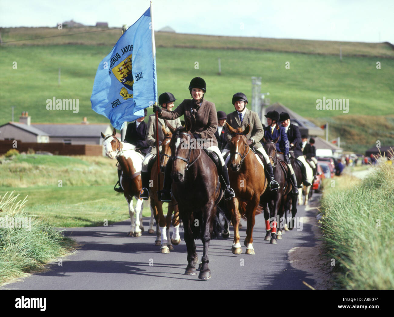 dh Riding of the Marches KIRKWALL ORKNEY Flag bearer riding Kirkwall boundaries at Scapa beach road Stock Photo