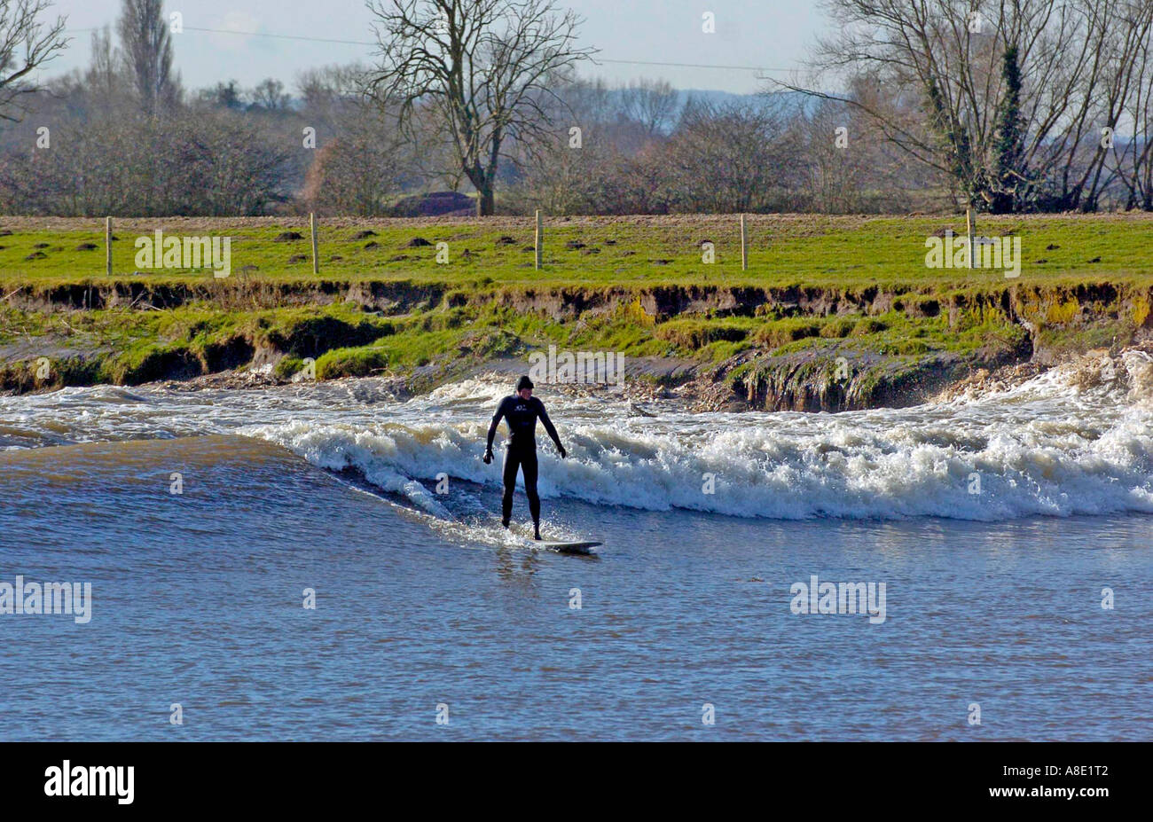 SURFING THE LARGEST SEVERN BORE OF THE YEAR NEAR GLOUCESTER IN ENGLAND