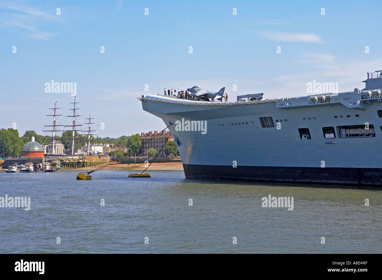 HMS Invincible moored on the Thames at Greenwich - contrast with Cutty Sark Stock Photo