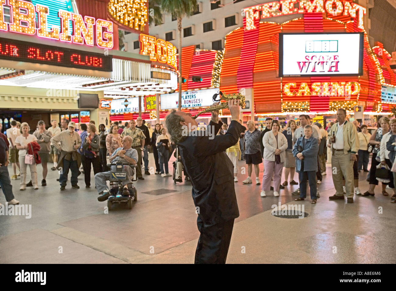 Downtown, Las Vegas - Fremont Street Experience under a massive electronic canopy - Saxophonist entertains crowd Stock Photo