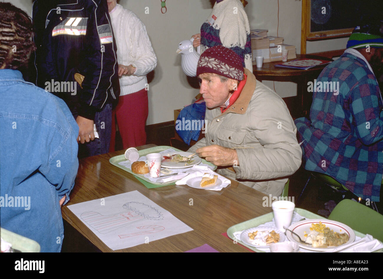 Homeless man age 52 eating at church Christmas soup kitchen. Minneapolis Minnesota USA Stock Photo