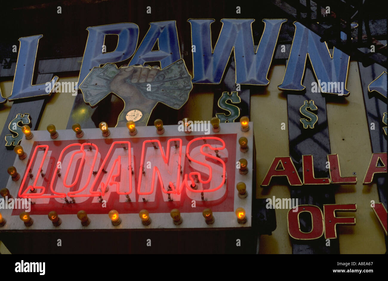 Pawn shop's neon sign glowing last chance desolation. Chicago Illinois USA Stock Photo