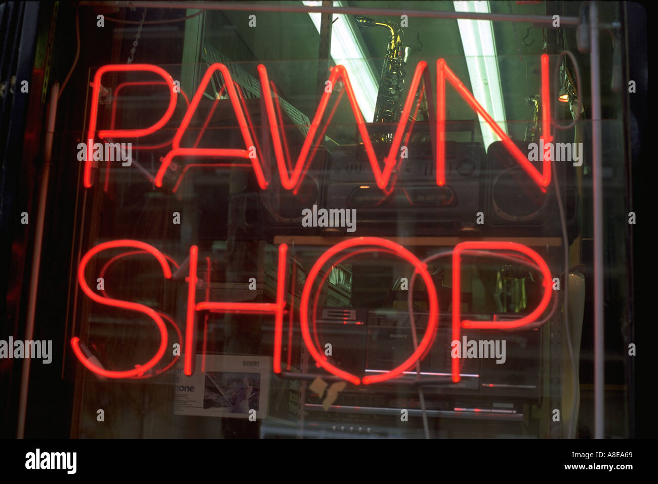 Pawn shop's neon sign glowing last chance deals and bargains. Chicago Illinois USA Stock Photo