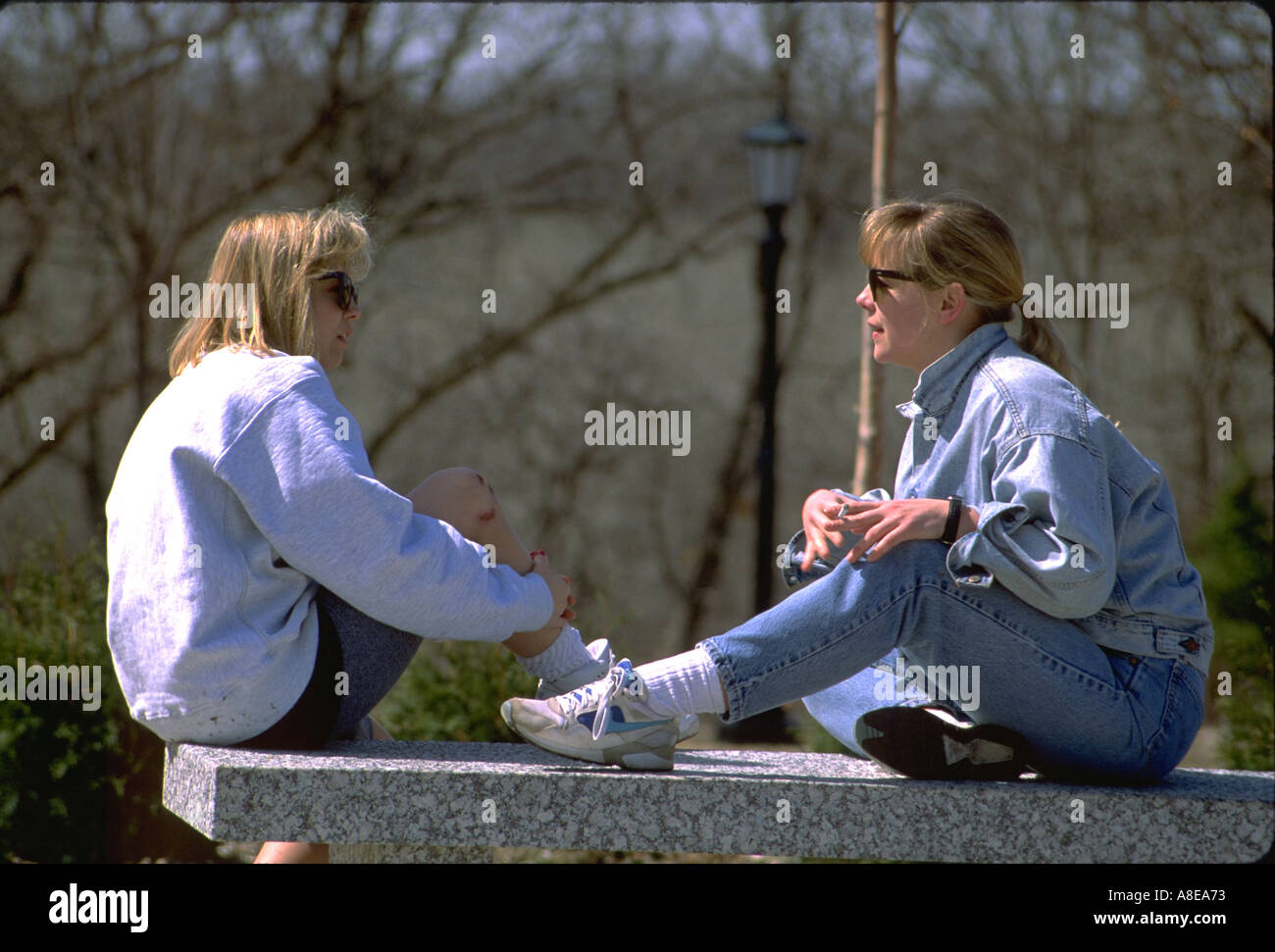 MS walk-a-thon participants age 20 taking a break smoking a cigarette. St  Paul Minnesota USA Stock Photo