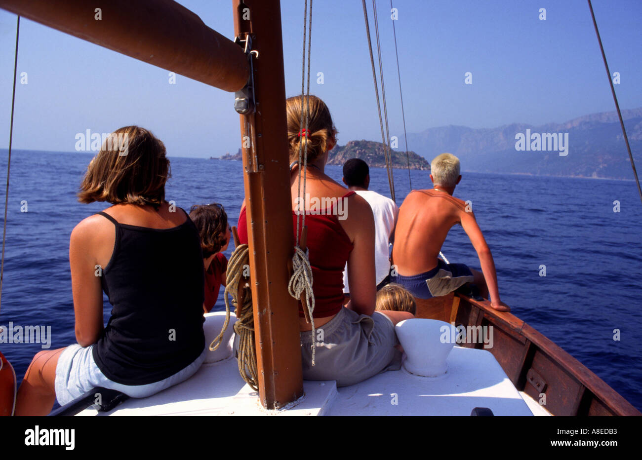 Group of teenagers on a boat arbatax Sardinia Italia Stock Photo
