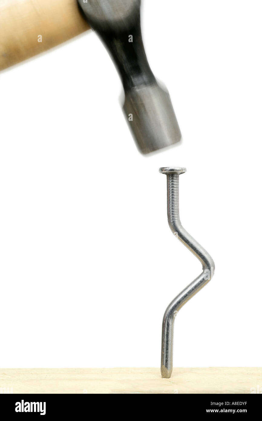 Hammering Bent Nail Stock Photo