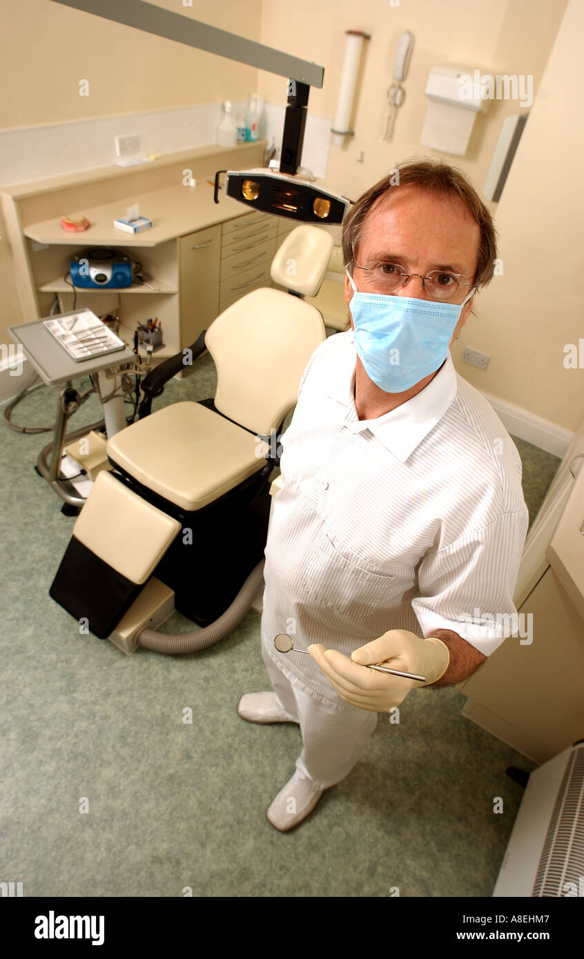 Dentist with chair and mirror tool Stock Photo Alamy