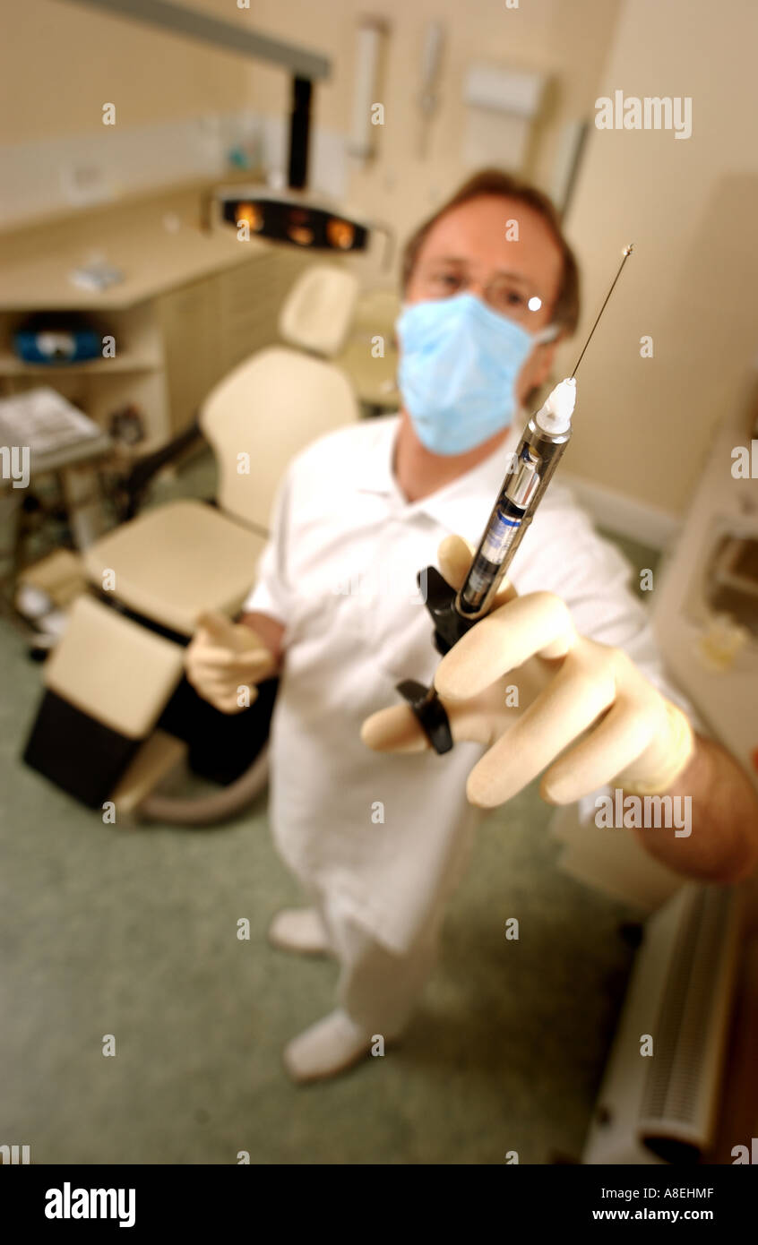 Dentist with syringe needle for anaesthetic Stock Photo Alamy