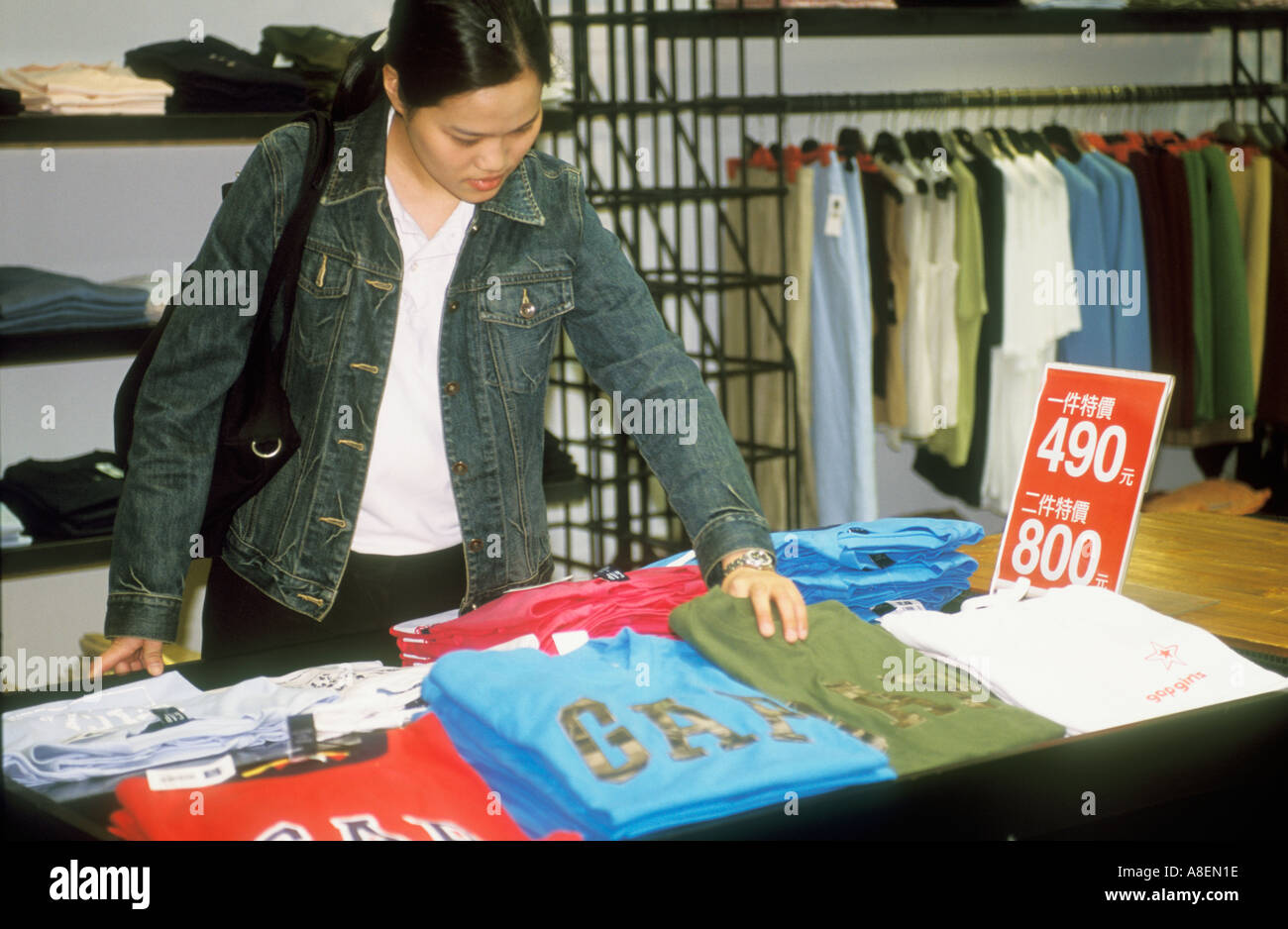 Asian Young Woman Clothes Shopping At The Gap Taiwan Republic Of China Stock Photo
