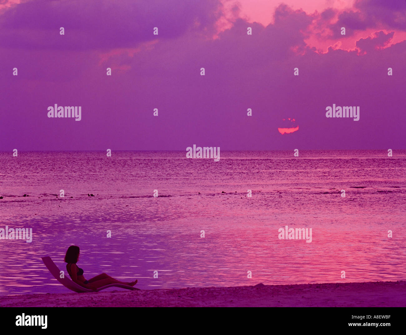Maldives islands Indian ocean Baa atoll sunset beach, woman Stock Photo