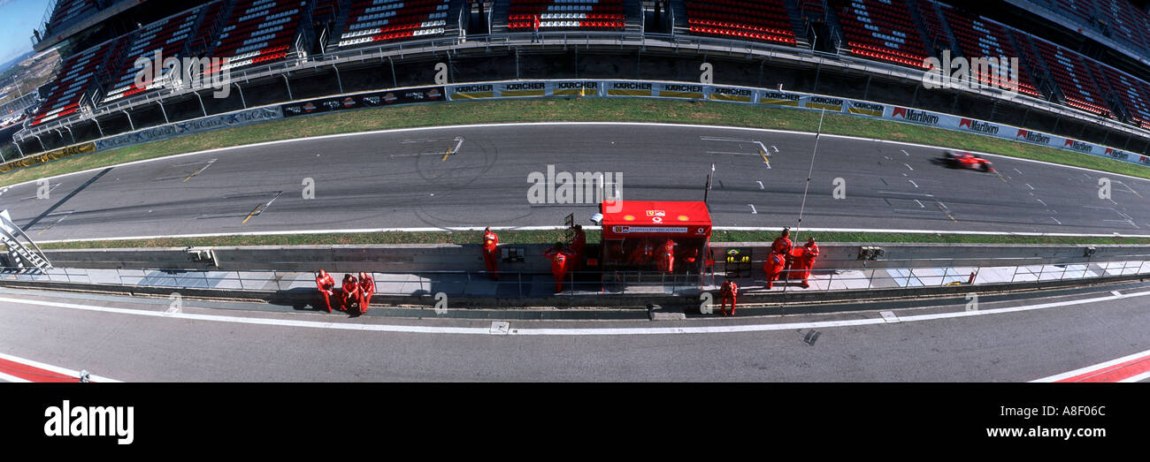 Panoramic view of the racing track and pit lane with mechanics at ...