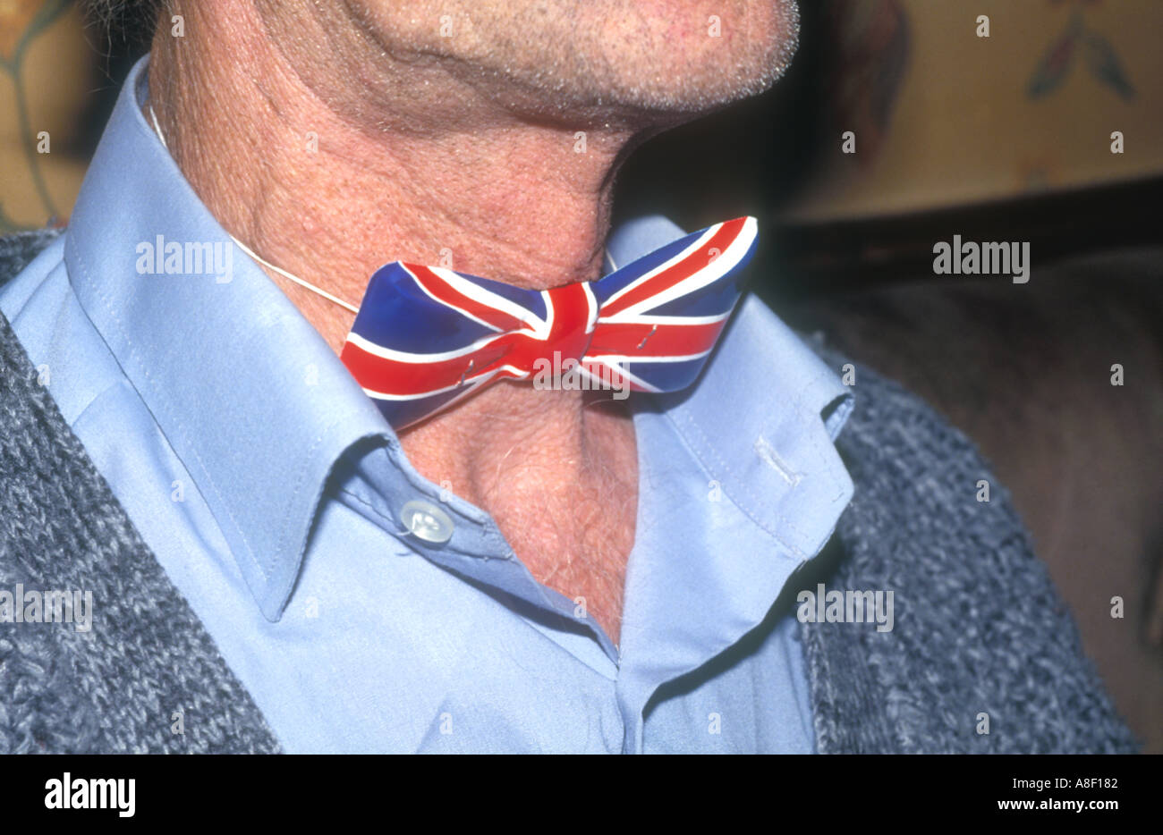 Close up of a plastic Union Jack bow tie on a man's neck. Stock Photo
