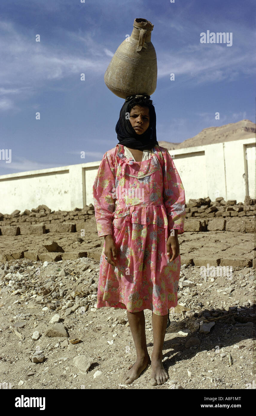 geography / travel, Egypt, people, girl carrying jug on her head, full figure, child labour, jar, , Stock Photo