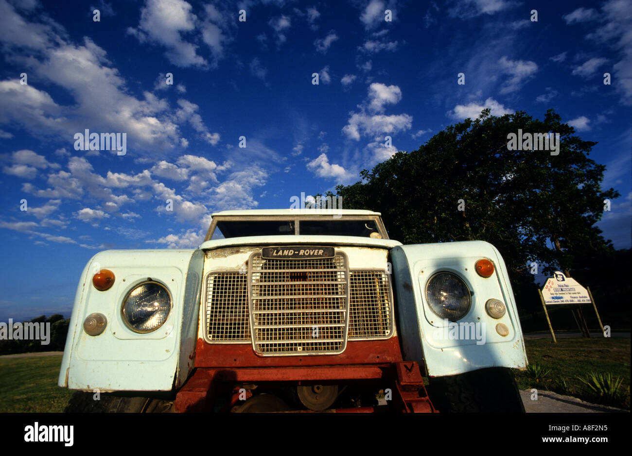 The front of a vintage series 1 land rover can be seen in front of scudding clouds. Stock Photo