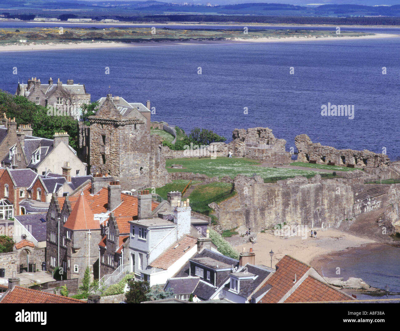 dh Town Fifeshire coastal towns ST ANDREWS FIFE Scottish castles Houses and West Sands beach north sea uk scotland castle coast Stock Photo