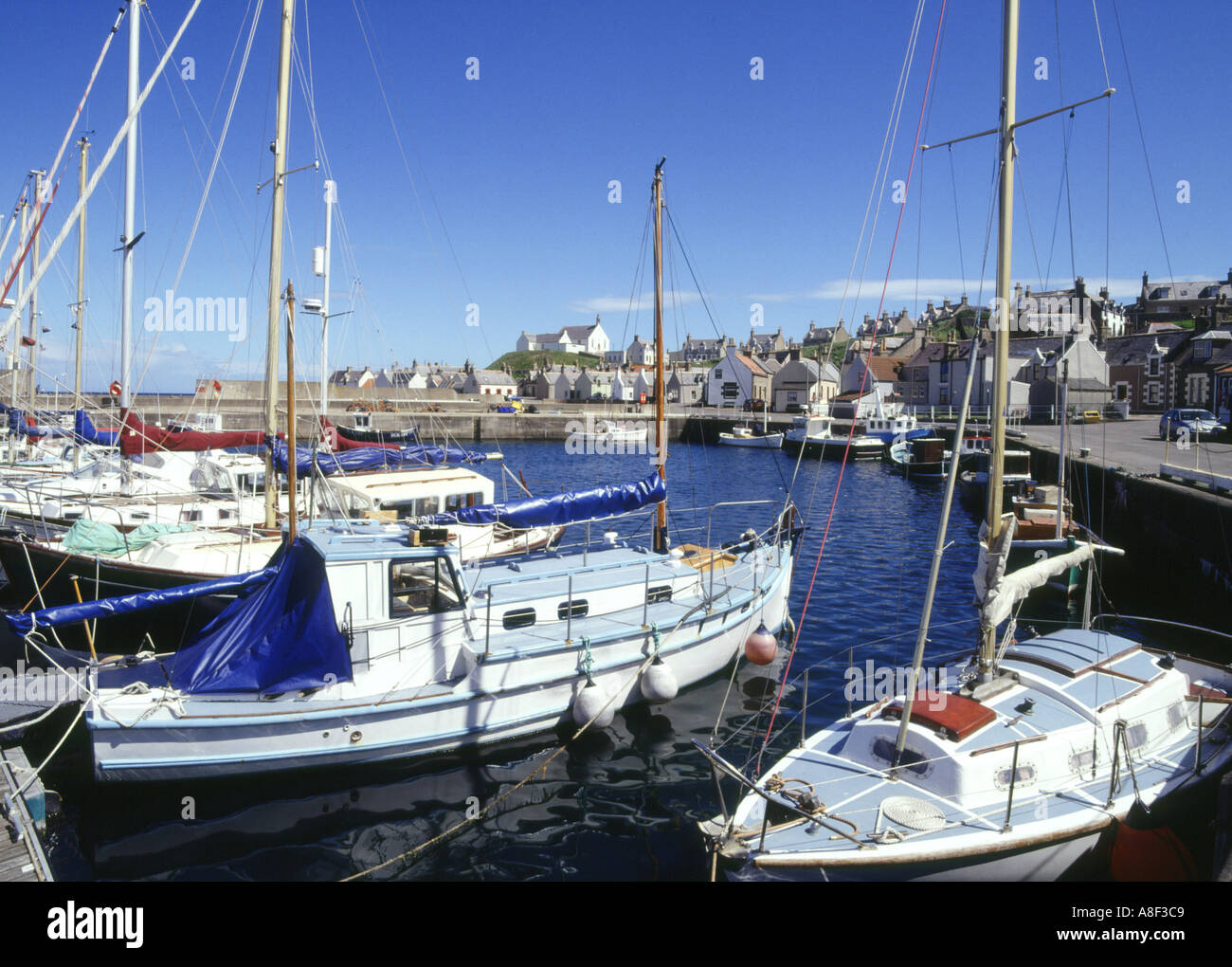dh FINDOCHTY MORAY Yachts in harbour church and fishing village scotland Stock Photo