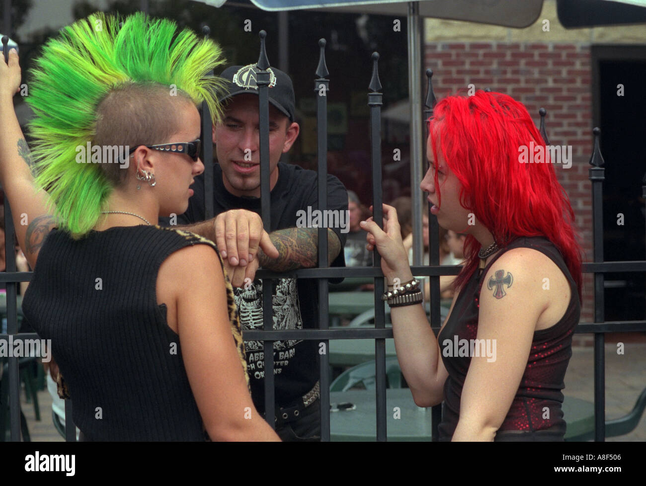 Punk rocker teens age 16 with green Mohawk at Cedarfest. Minneapolis Minnesota USA Stock Photo