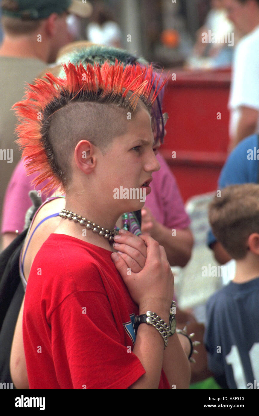 Punk rocker with Mohawk age 14 putting hands over heart. St Paul Minnesota USA Stock Photo