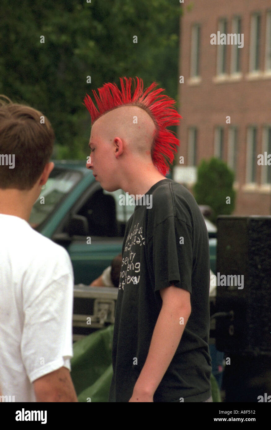 Punk rocker age 17 hanging out with friends at Grand Old Day. St Paul Minnesota USA Stock Photo