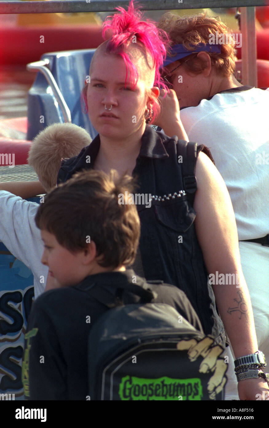 Punk teen age 17 with fuchsia Mohawk at Minnesota State Fair. St Paul Minnesota USA Stock Photo