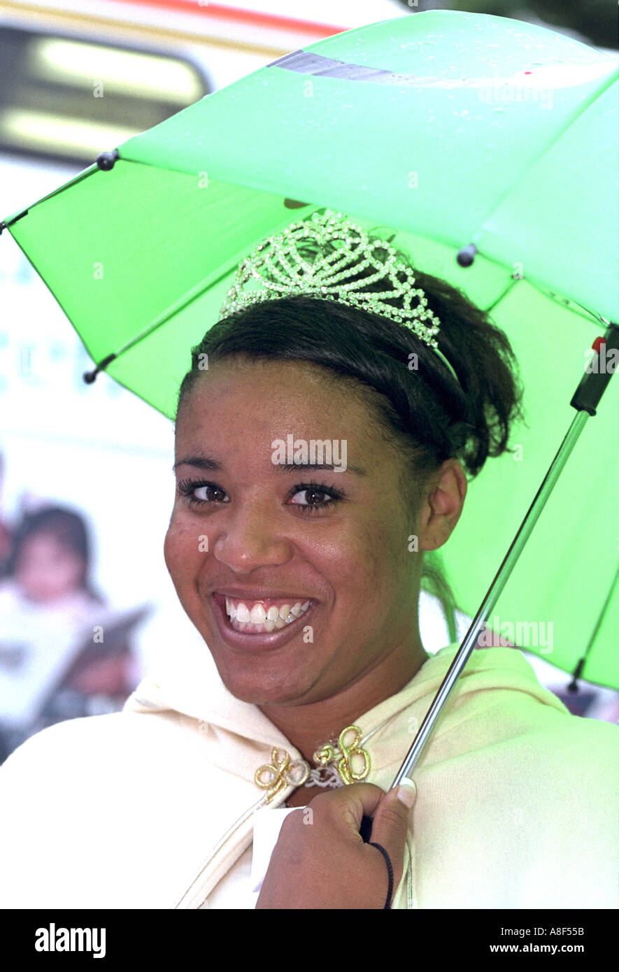 Queen age 17 with umbrella at the Parktacular Parade. St Louis Park Minnesota USA Stock Photo