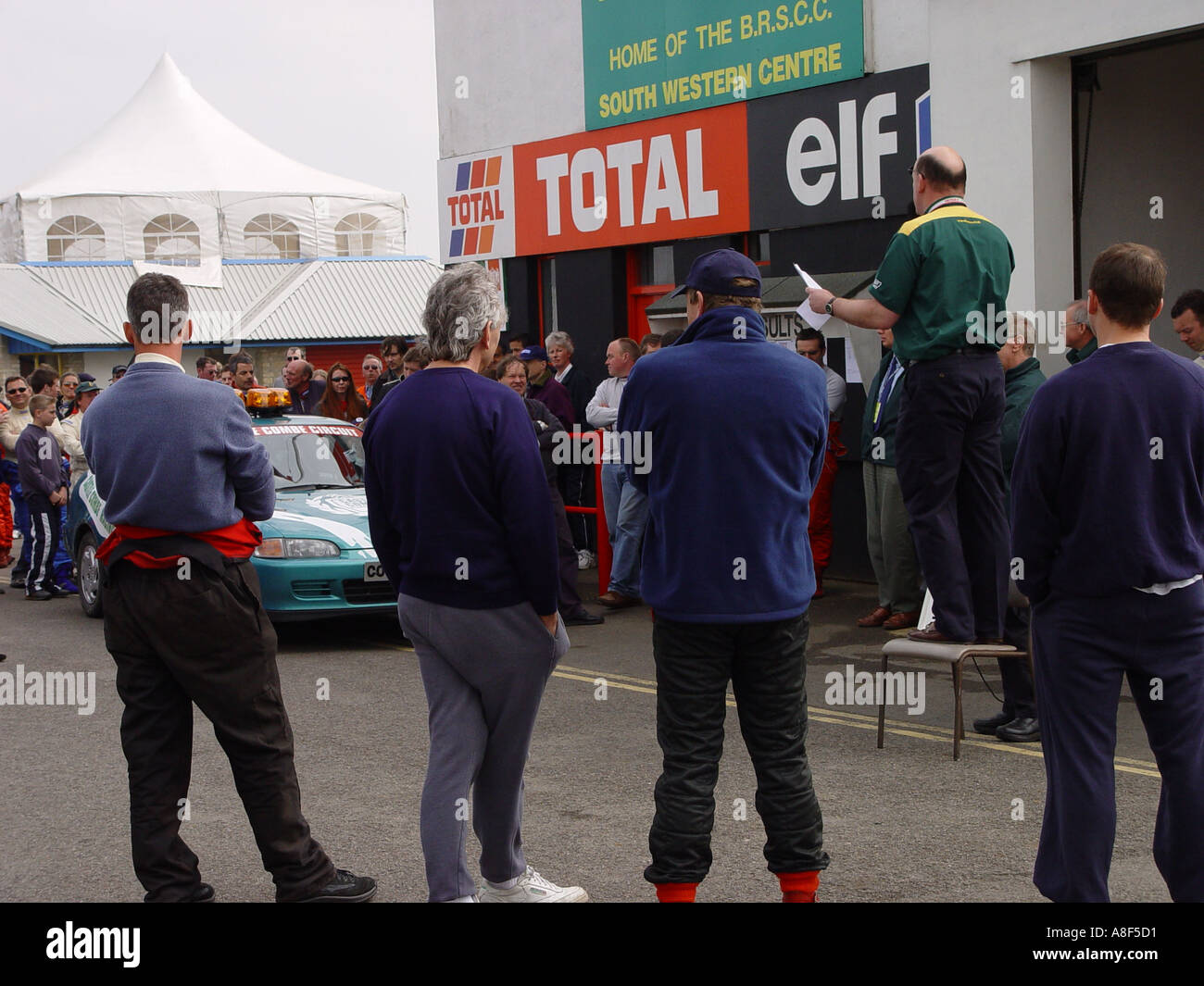 Drivers meeting with Rowan Atkinson as one of the competitors at a motor racing circuit England GB UK 2003 Stock Photo