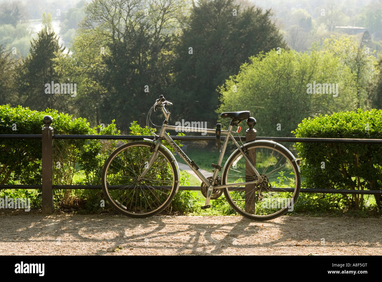 Bicycle chained to railings Richmond London England UK Stock Photo