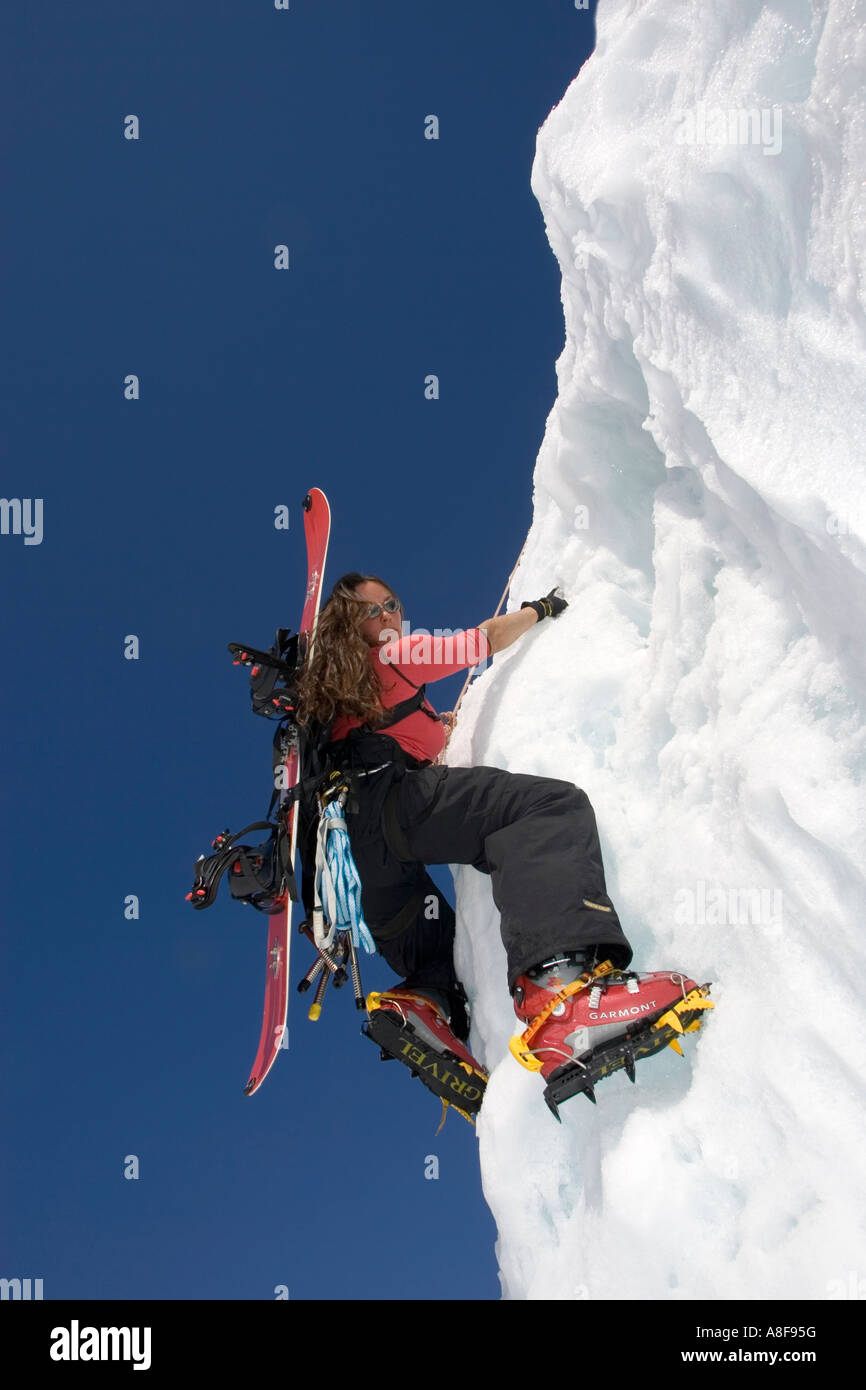 Women Ice Climbing with Snowboard on backpack Stock Photo Alamy