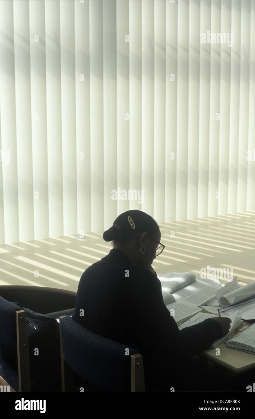 A student at work in the library of the Hackney Community College, London. Stock Photo