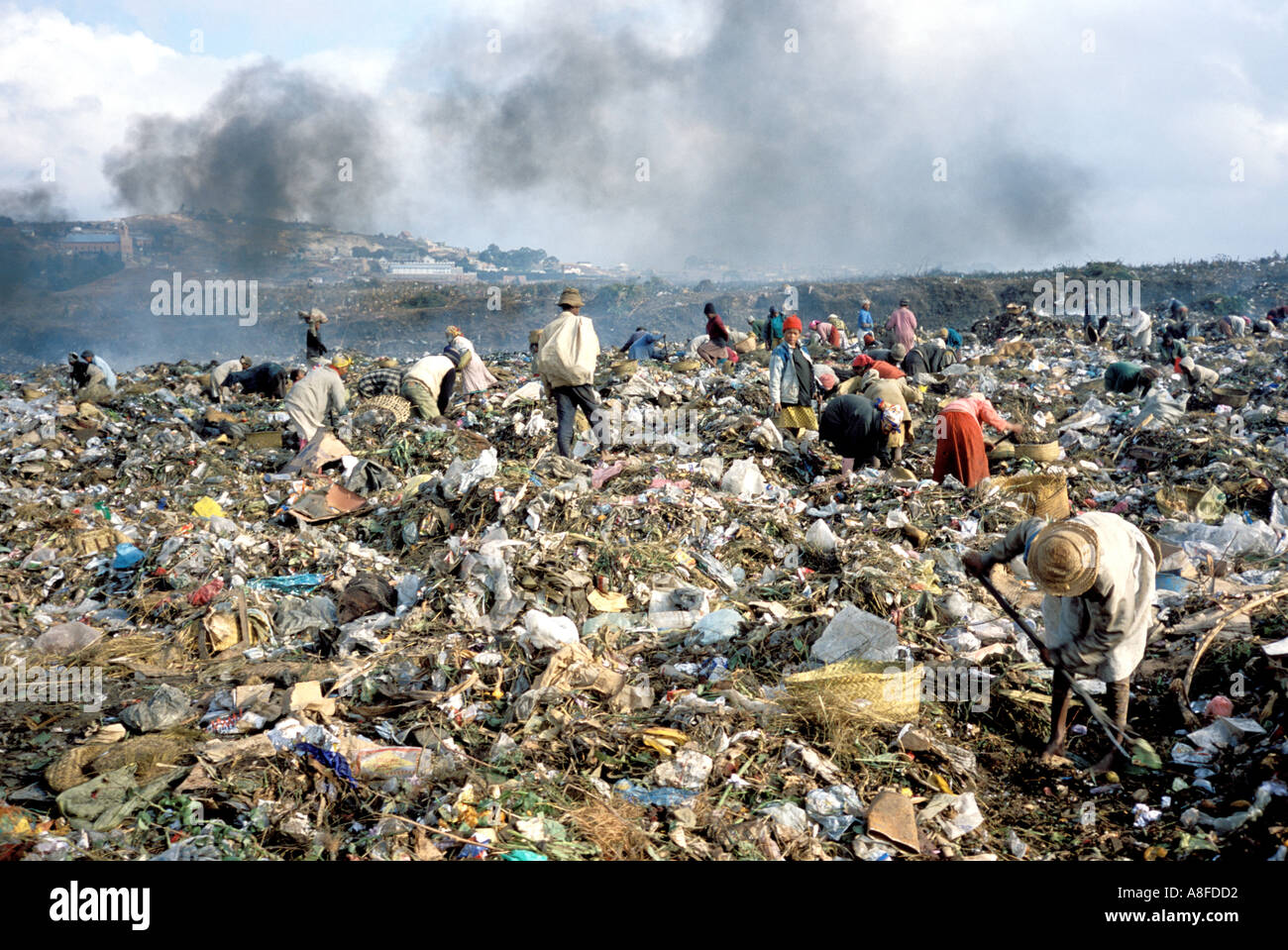 people picking through garbage in antananarivo madagascar Stock Photo