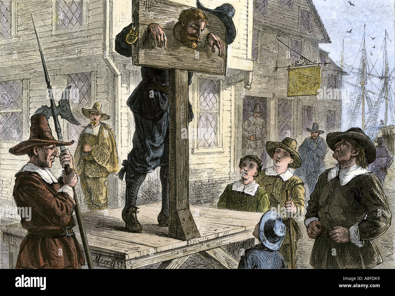 Offender punished by standing in the pillory in a Puritan seaport town 1600s. Hand-colored woodcut Stock Photo