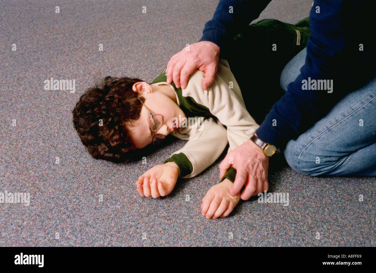 Child resuscitation recovery position Stock Photo
