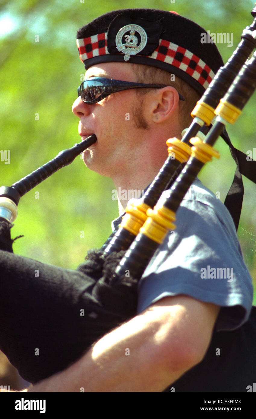 Scottish bagpiper age 38. In the Heart of the Beast May Day Festival and Parade Minneapolis Minnesota USA Stock Photo